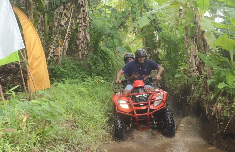 Guests riding an ATV quad bike through the Ubud jungle