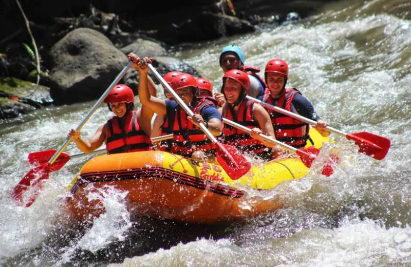 Rafting group paddling through rapids on the Ayung River
